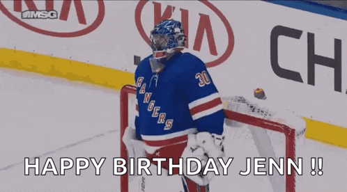 a hockey goalie celebrates a goal in front of a kia ad
