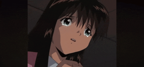 a girl with long hair is crying in a dark room