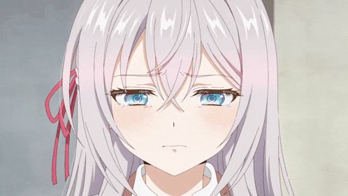 a girl with white hair and blue eyes looks sad