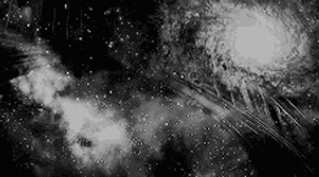a black and white photo of a galaxy in the sky