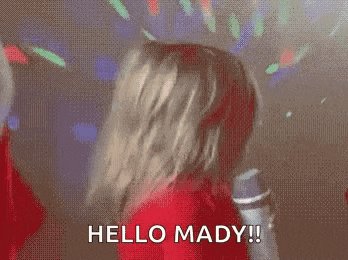a little girl is holding an ice cream cone in her hand and saying `` hello mady ! ''
