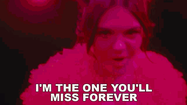 a woman in a pink fur coat is singing i 'm the one you 'll miss forever