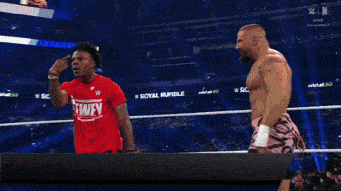 a wrestler in a red shirt with the number 7 on it is eliminated