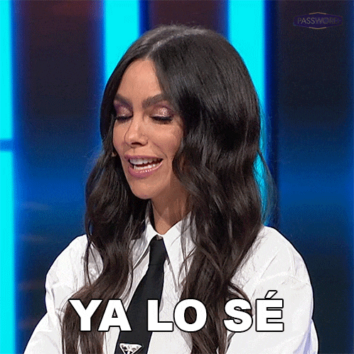 a woman wearing a tie and a white shirt is smiling and saying ya lo se