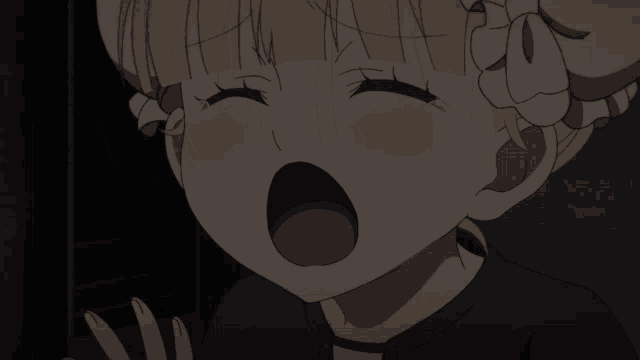 a close up of a girl 's face with her mouth wide open