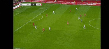 a soccer game is being played between poland and turkish
