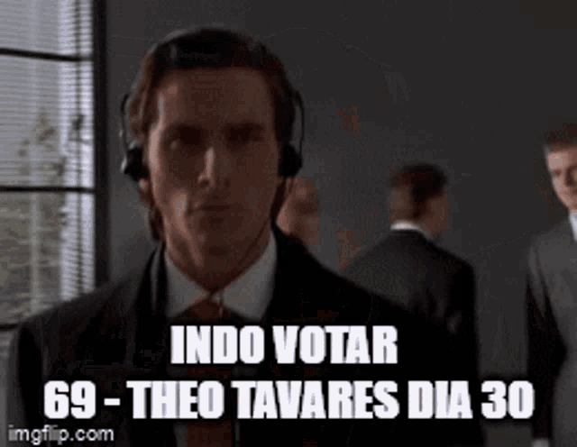 a man wearing headphones with the words indo votar 69-theo tavares dia 30