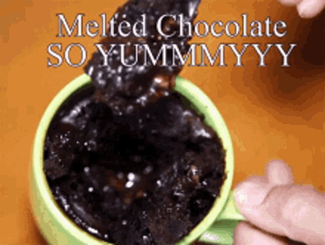 a person pouring melted chocolate into a green cup