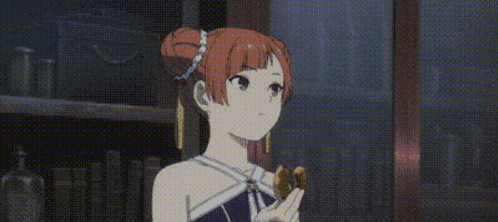 a girl with red hair is standing in front of a bookshelf holding a piece of food in her hand .