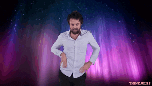 a man in a white shirt is standing in front of a purple background with think jules written in red