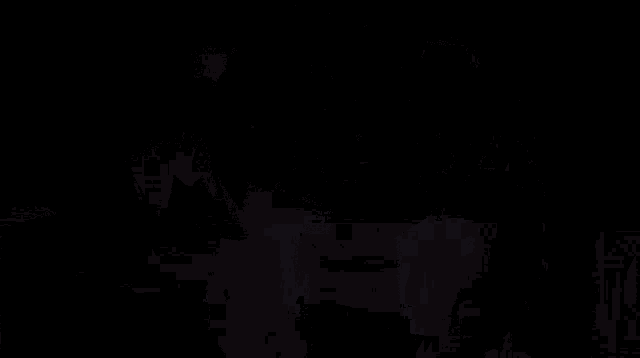 two men in suits and ties are standing next to each other with their arms outstretched