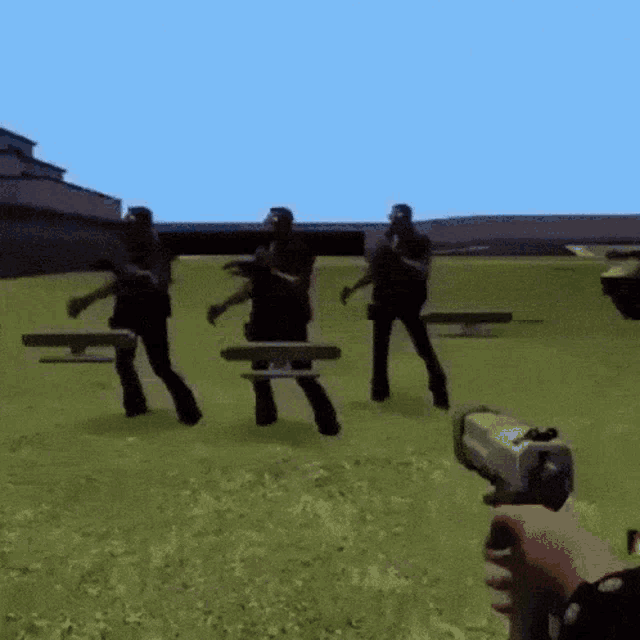 a person is holding a gun in front of a group of people dancing