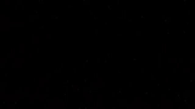 a black background with a lot of small dots on it