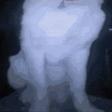 a statue of a man is covered in a thick layer of blue smoke
