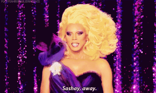 a drag queen is wearing a purple and black dress and saying sashay away .