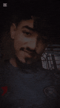 a man with a beard has a smiley face on top of his head