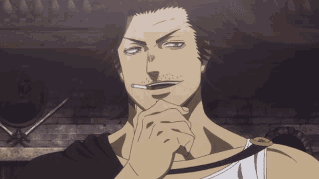 a man with a cigarette in his mouth looks serious