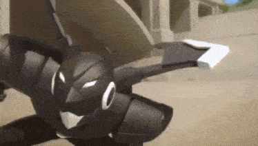 a black robot is flying through the air while holding a piece of paper in its hand .
