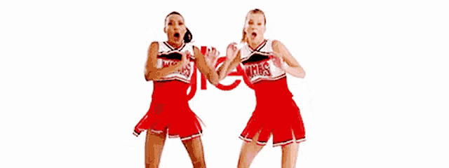two cheerleaders playing with a ball in front of a glee logo