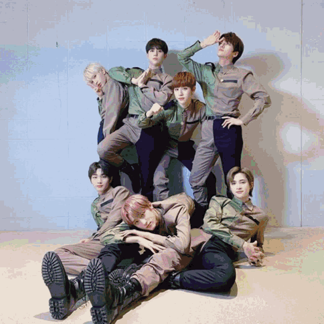 a group of young men are posing for a picture
