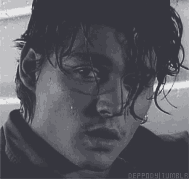 a close up of a man 's face with the words deppody tumblr written below it