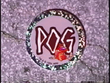 a sticker that says ' pog ' on it is laying on the ground