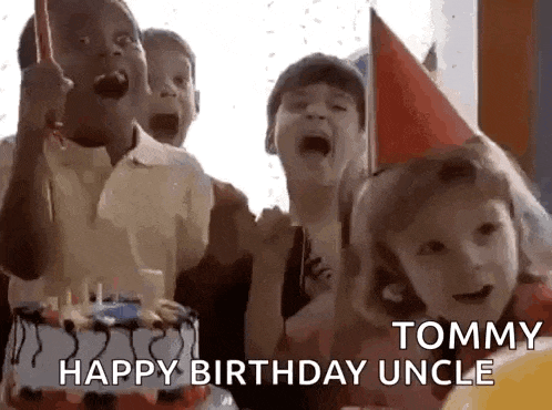 a group of children are sitting around a birthday cake .