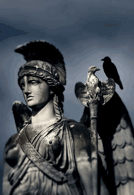 a statue of a woman with a bird perched on her shoulder has the word ' apollo ' written on it