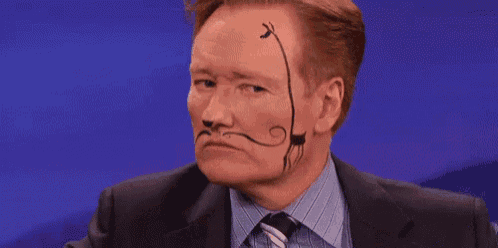 conan o'brien has a cat painted on his face .