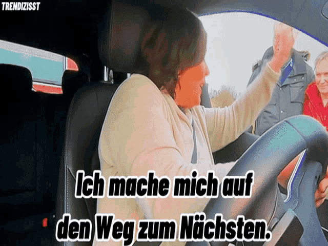 a woman driving a car with the words ich mache mich auf den weg zum nachsten