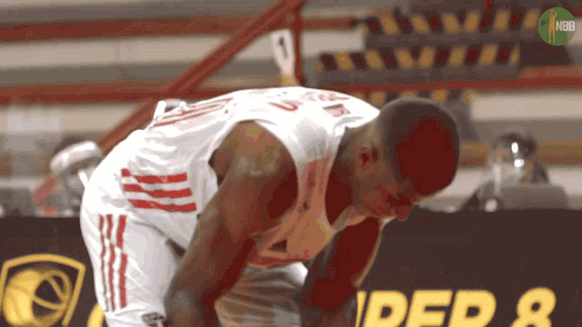 a basketball player wearing a white jersey with the number 5 on it