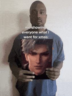 a man holding a picture of a man with the caption me showing everyone what i want for christmas