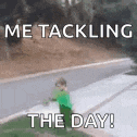 a little boy in a green shirt is standing on the side of the road .