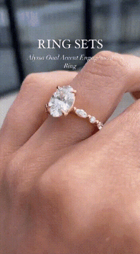 a woman is wearing a ring that says ring sets on it