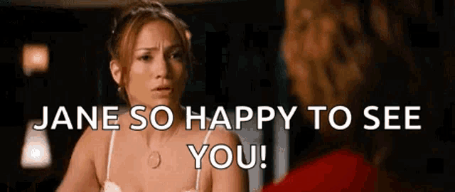 a woman in a white bra is talking to another woman and says `` jane so happy to see you ! ''