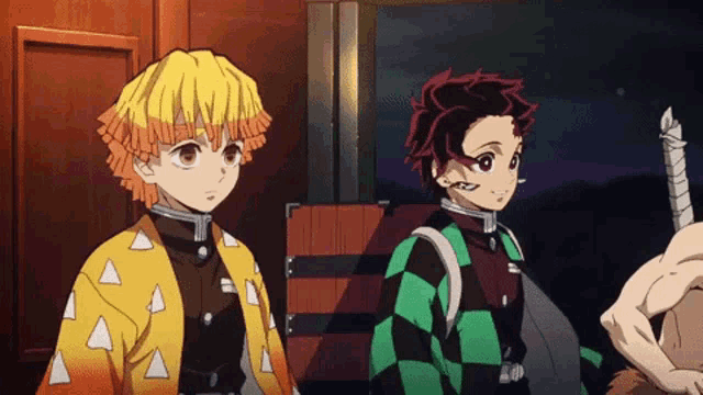 two anime characters are standing next to each other in front of a wooden box