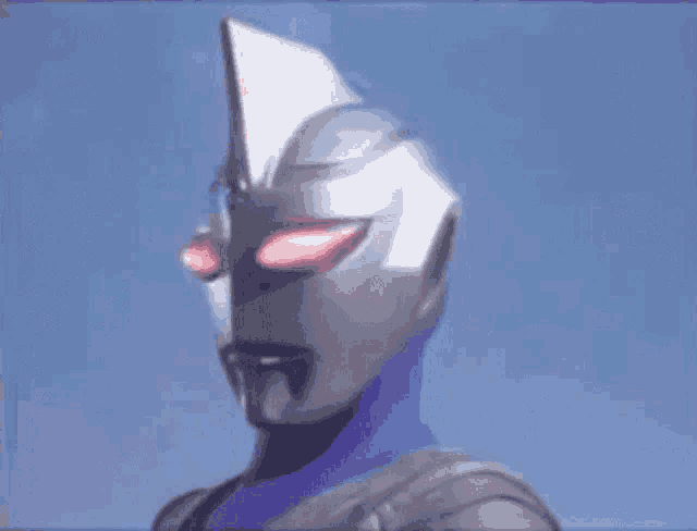 a close up of a cartoon character with red eyes and a purple suit .