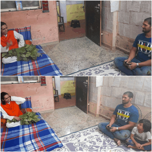 a man wearing a d.r.d. t-shirt sits on the floor next to a woman on a bed