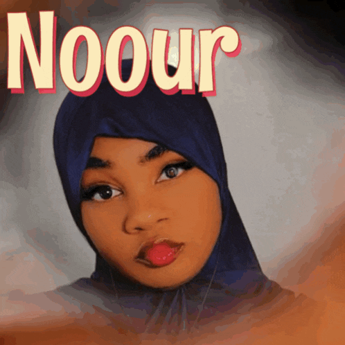 a woman wearing a blue hijab with the name noour on the top