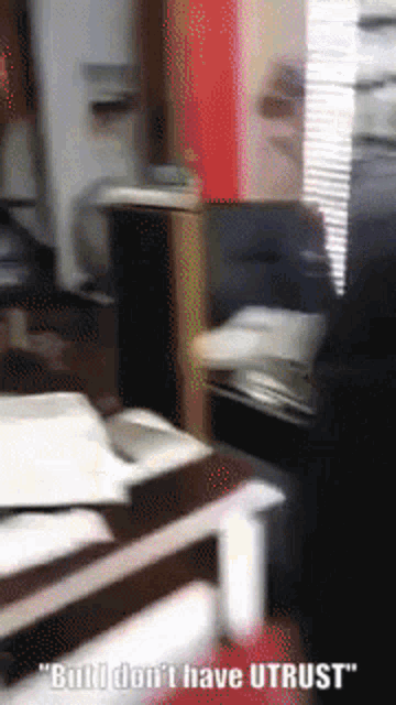 a blurred image of a room with the words " build don 't have utrust " on the bottom