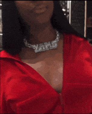 a woman with blue hair and a red jacket stands in front of a sign that says yi