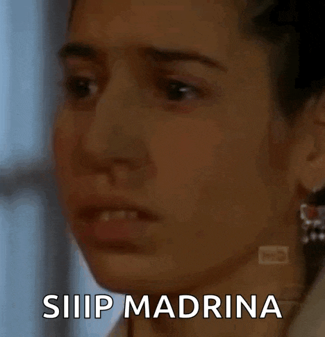a close up of a woman 's face with the words siiiiip madrina written on it .