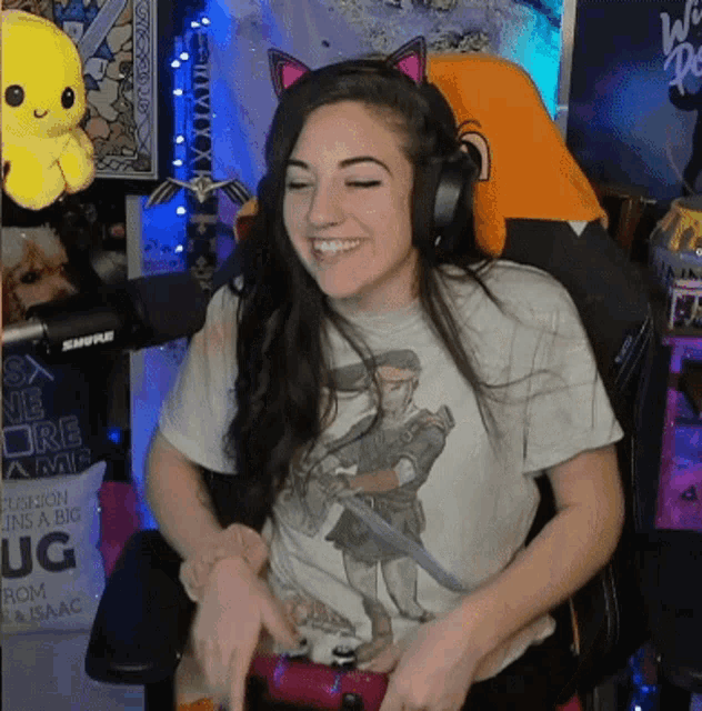 a woman wearing headphones and a t-shirt with a knight on it