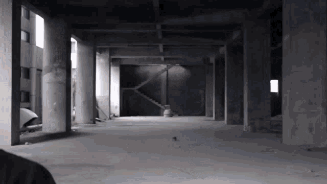 an empty building with a staircase in the middle