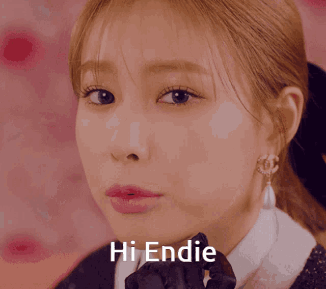 a close up of a woman 's face with the words hi endie written above her