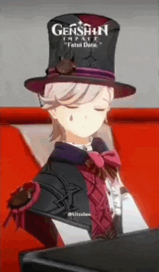 a cartoon character wearing a top hat and a bow tie is sitting on a red couch .