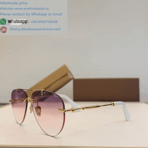 a pair of sunglasses with the website www.ecwholesaler.ru written on the bottom