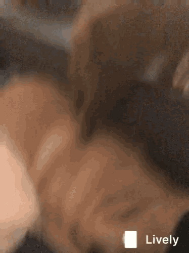 a close up of a person 's face with the word lively on the bottom right