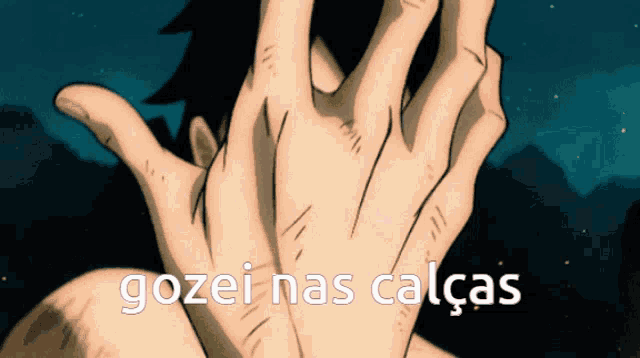a person covering their face with their hands and the words gozei nas calças written below them