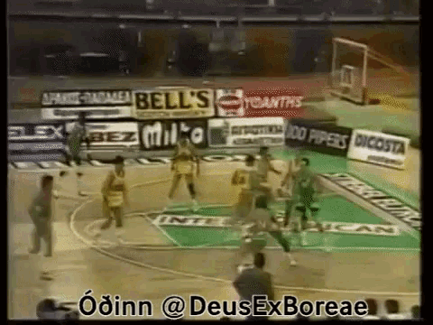 a basketball game is being played in front of advertisements for bell 's milto and dicosta
